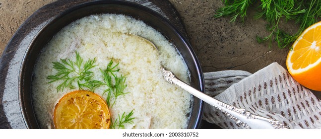 Bowl Of Greek Chicken Avgolemono Soup On The Table