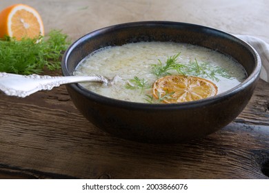 Bowl Of Greek Chicken Avgolemono Soup On The Table