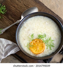 Bowl Of Greek Chicken Avgolemono Soup On The Table