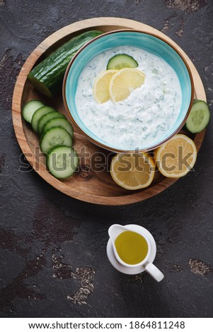 Similar – Tzatziki and pita bread on marble