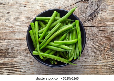 Bowl Of Green Beans On Wooden Background, Top View