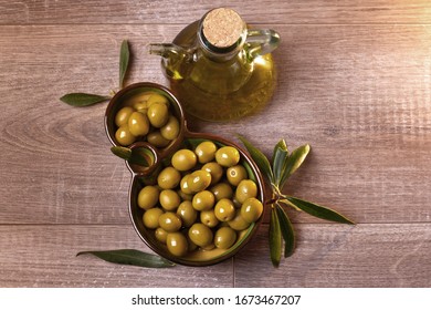 Bowl Of Green Olives With Virgin Olive Oil Overhead View