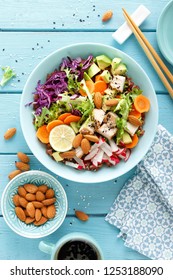 Bowl With Grilled Chicken Meat, Brown Rice And Fresh Vegetable Salad Of Avocado, Radish, Cabbage Kale, Carrot, And Lettuce Leaves. Healthy And Delicious Dietary Lunch. Top View