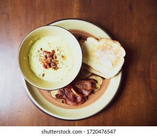 Bowl Of Grits With Bacon And Toast