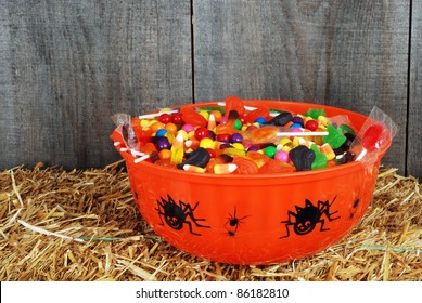 Bowl Of Halloween Candy On Straw