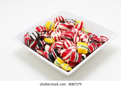 A Bowl Of Hard Candy Shot On White, Very Colorful And Saturated Colors