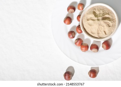 Bowl With Hazelnut Flour On Table, Top View. Gluten Free Low Carbohydrate Diet.