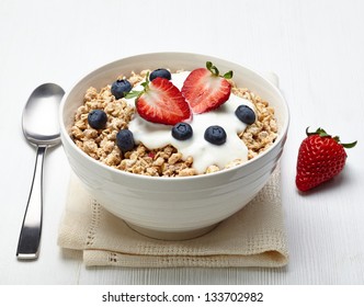 Bowl of healthy muesli with yogurt and fresh berries - Powered by Shutterstock