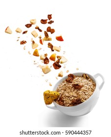 Bowl Of Healthy Oatmeal With Falling Fruit, Nuts And Cookie In The Air. Hot And Healthy Food For Breakfast, Top View, Flat Lay Isolated On White Background