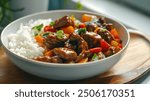 A bowl of hearty beef stir-fry, complete with vibrant slices of bell pepper and sugar snap peas, atop a bed of steamed white rice