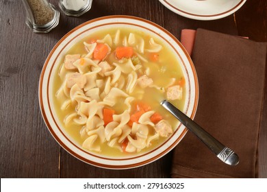 A Bowl Of Hearty Chicken Noodle Soup Shot From Overhead