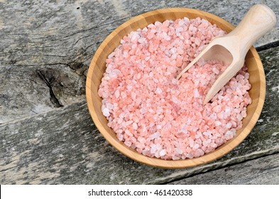 Bowl with himalayan pink salt on wooden table - Powered by Shutterstock