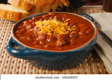 A Bowl Of Hot Chili With Melted Cheese