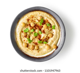 bowl of hummus isolated on white background, top view