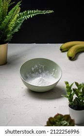 A Bowl Of Icing Sugar In Preparation For Baking Banana Bread.