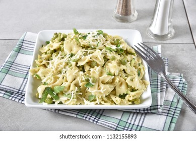 A Bowl Of Lemon Basil Pasta Salad With Peas