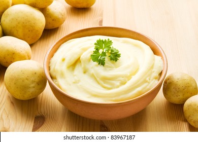 Bowl with mashed potatoes decorated with potatoes - Shutterstock ID 83967187
