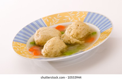 Bowl Of Matzah Ball Soup On White Background