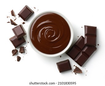 Bowl of melted dark chocolate and broken pieces of chocolate bar isolated on white background, top view