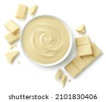 Bowl of melted white chocolate and broken pieces of chocolate bar isolated on white background