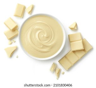 Bowl of melted white chocolate and broken pieces of chocolate bar isolated on white background