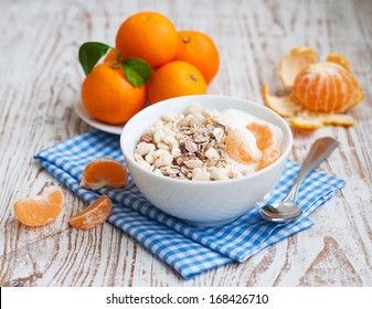 bowl of muesli with fresh tangerines - Powered by Shutterstock