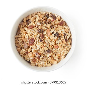 Bowl of muesli isolated on white background, top view