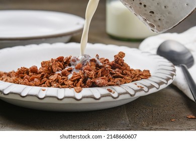 Bowl Of Muesli With Milk. Breakfast Muesli Splash. Healthy Breakfast.  Healthy Chocolate Granola In A Bowl. Shallow Depth Of Field