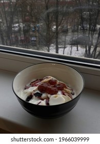 The bowl muesli with yogut, banana and jam