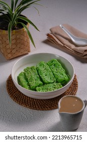 A Bowl Nettle Bread , Or Roti Jala.  Jala Bread Eaten With Gravy. Plant, Napkin, Spoon As Element. Roti Jala Kinca Durian