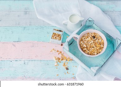 Bowl of oat flakes and milk on background 