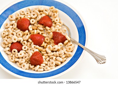 A Bowl Of Oat O Cereal With Milk And Strawberries - Breakfast.  On White Background