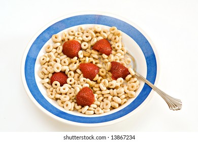 A Bowl Of Oat O Cereal With Milk And Strawberries - Breakfast.  On White Background