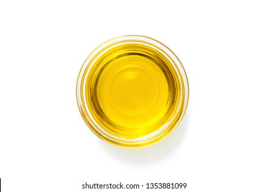 Bowl with olive oil isolated on white .
