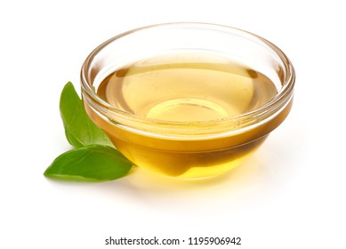 Bowl With Olive Or Vegetable Oil With Basil Leaves, Close-up, Isolated On White Background.