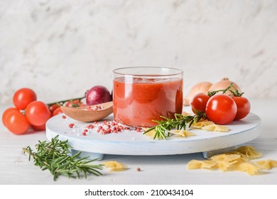 Bowl with organic tomato sauce on table - Shutterstock ID 2100434104