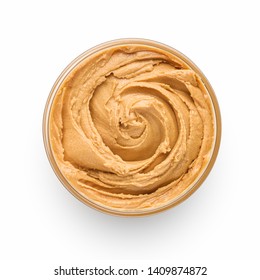 Bowl of peanut butter isolated on white background, top view