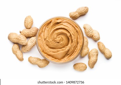 Bowl of peanut butter and unshelled scattered peanuts on white background, isolated - Powered by Shutterstock