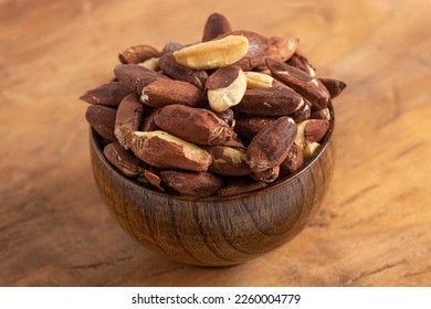 A Bowl of Pili Nuts from the Philippines on a Wooden Table - Shutterstock ID 2260004779