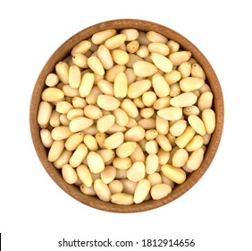 Bowl with pine nuts on white background, delicious, natural