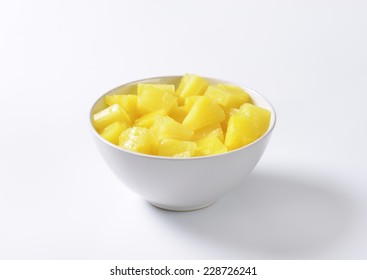Bowl Of Pineapple Pieces On White Background