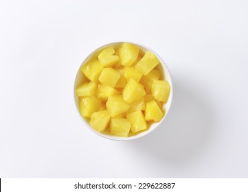 Bowl Of Pineapple Pieces On White Background