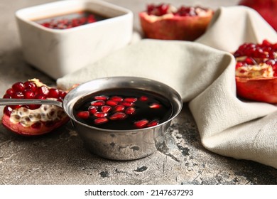 Bowl Of Pomegranate Molasses On Table