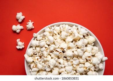 Bowl Of Popcorn On A Red Background. View From Above