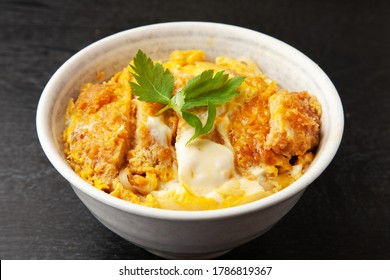 A Bowl Of Pork Cutlet With Egg And Rice