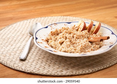 A Bowl Of Porridge With Apple And Cinnamon Spices