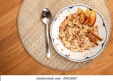 A Bowl Of Porridge With Apple And Cinnamon Spices