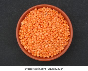 Bowl Of Red Lentil On Black Background Top View