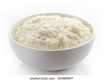 Bowl Of Rice Flakes Porridge Isolated On A White Background