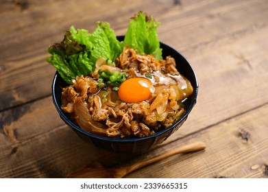 bowl of rice topped with pork and kimuchi
